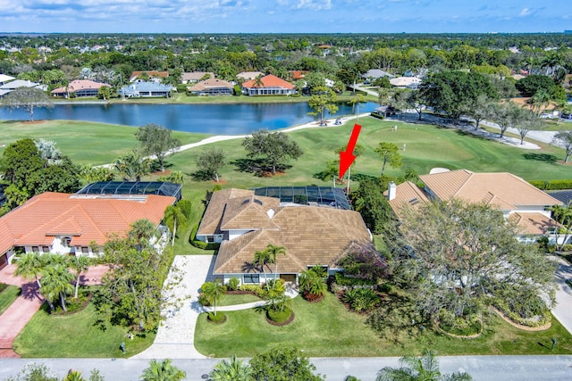 birds eye view of property with a water view