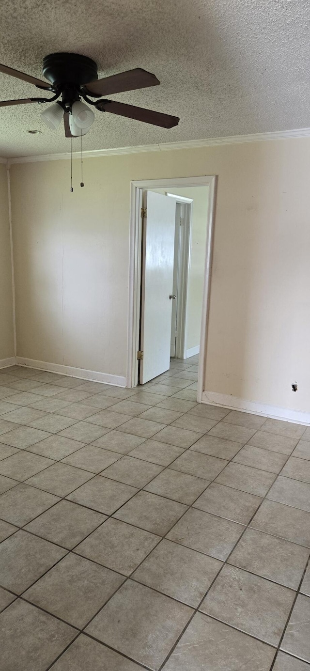 unfurnished room with light tile patterned floors, a textured ceiling, ceiling fan, and crown molding