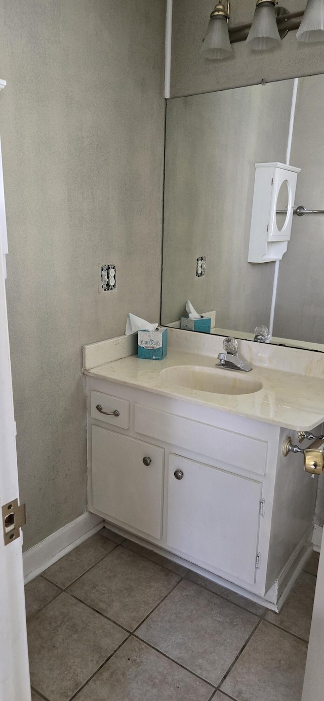 bathroom featuring tile patterned floors and vanity