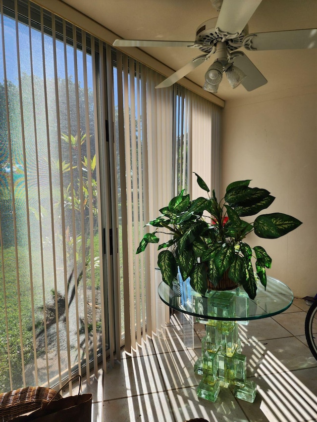 sunroom featuring ceiling fan