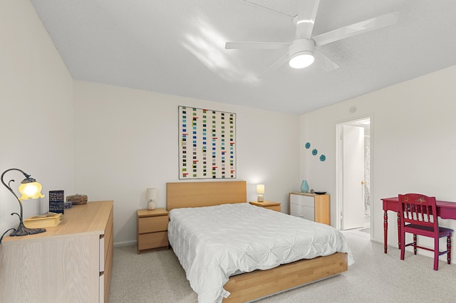 bedroom featuring ceiling fan and a textured ceiling