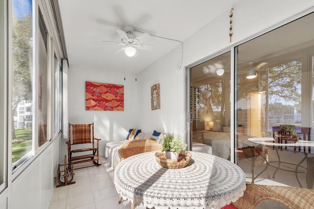 sunroom / solarium featuring ceiling fan