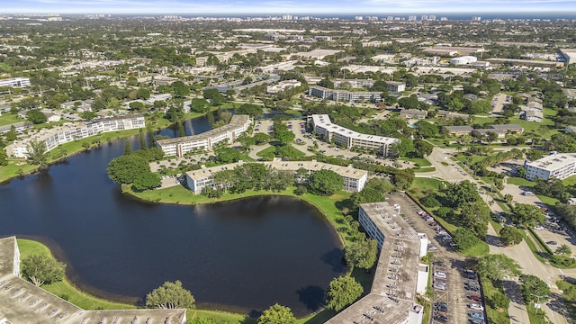 drone / aerial view with a water view