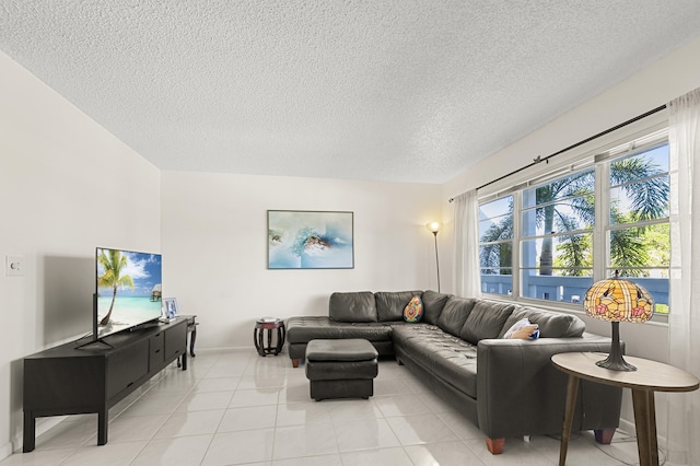 living room featuring light tile patterned floors and a textured ceiling