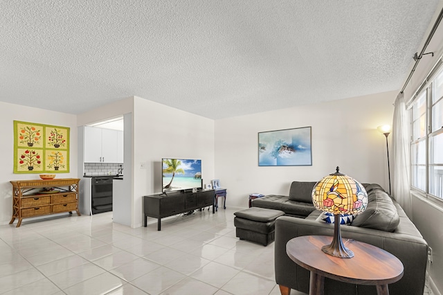 living room featuring a textured ceiling and light tile patterned flooring