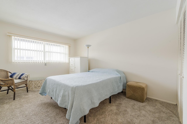 bedroom featuring light carpet