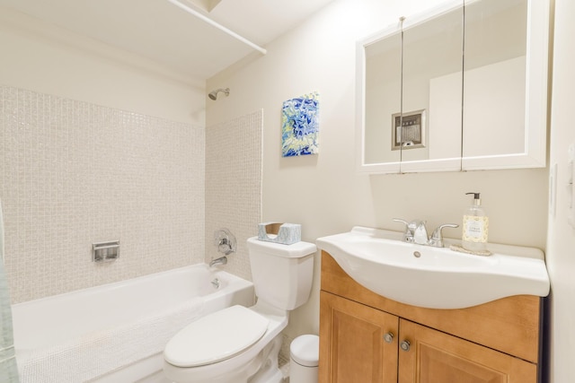 full bathroom with vanity, tiled shower / bath combo, and toilet