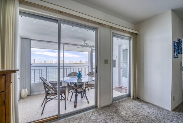 entryway featuring carpet flooring and ceiling fan