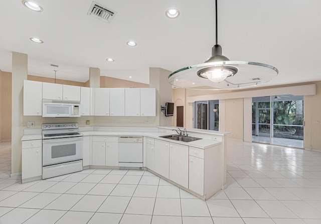 kitchen featuring sink, white cabinetry, white appliances, kitchen peninsula, and hanging light fixtures