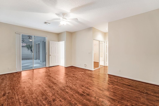 unfurnished room featuring a textured ceiling, ceiling fan, and hardwood / wood-style flooring