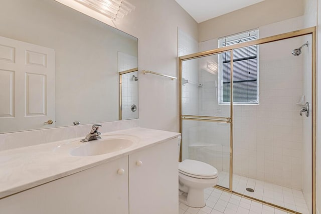 bathroom featuring toilet, a shower with shower door, and vanity