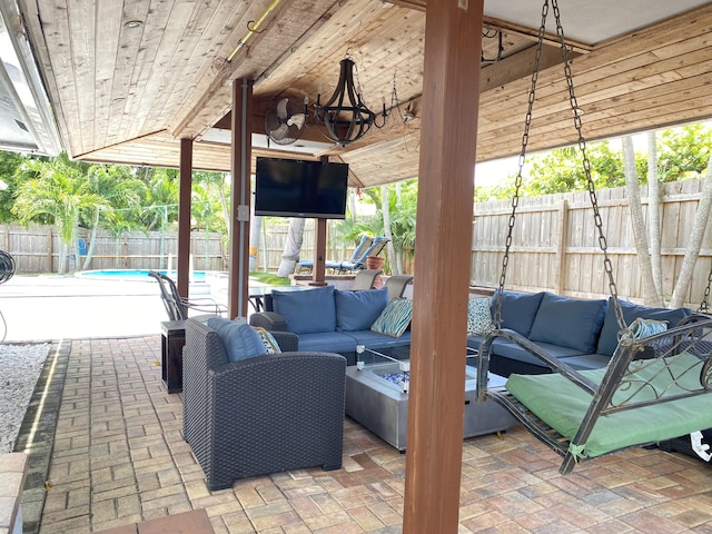 view of patio featuring outdoor lounge area and a fenced in pool