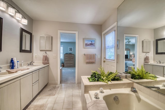 bathroom featuring ensuite bath, a bath, vanity, a ceiling fan, and tile patterned flooring
