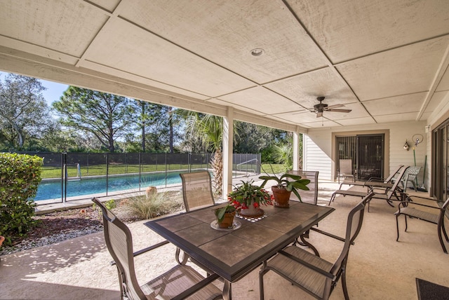 view of patio with ceiling fan and a fenced in pool