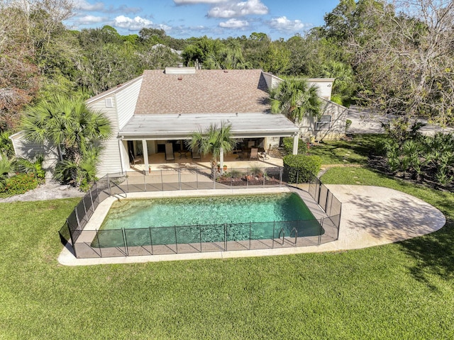 view of pool with a yard and a patio area