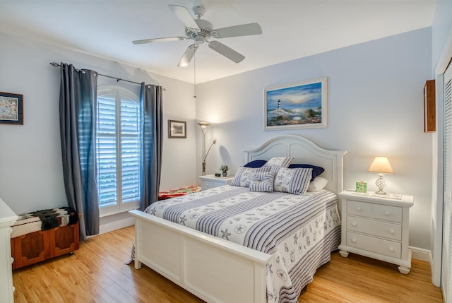 bedroom featuring ceiling fan and light hardwood / wood-style flooring