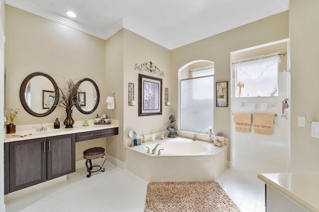 bathroom with tile patterned flooring, vanity, ornamental molding, and a tub to relax in