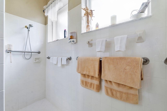 bathroom with a tile shower