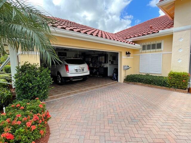 view of car parking with a garage