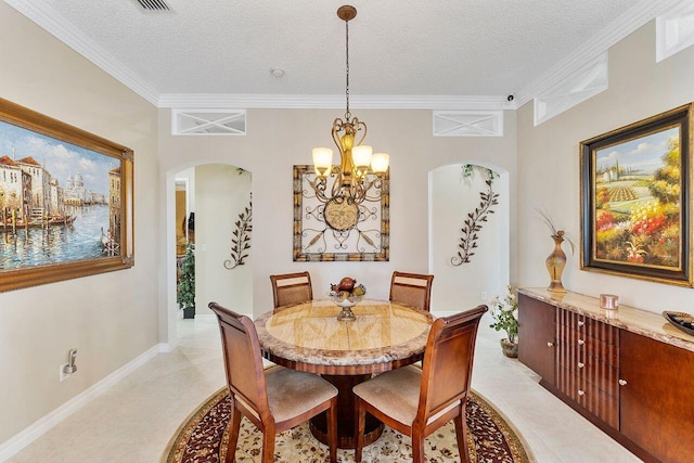 dining area featuring a chandelier, a textured ceiling, and crown molding