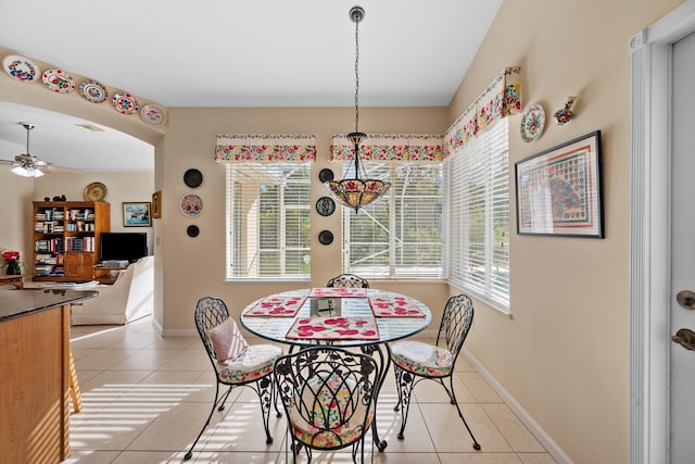 dining area with ceiling fan and light tile patterned floors