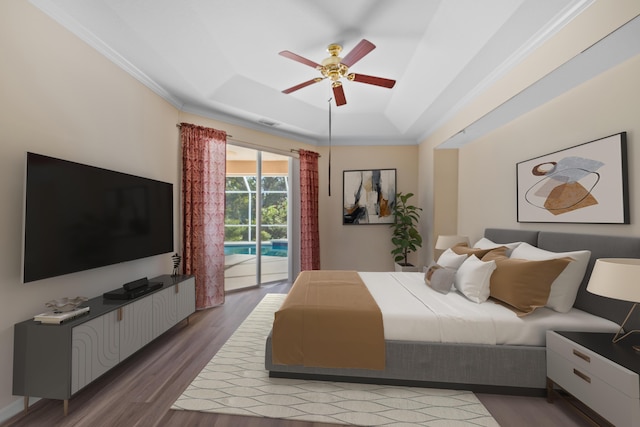 bedroom featuring ceiling fan, access to exterior, crown molding, and a raised ceiling