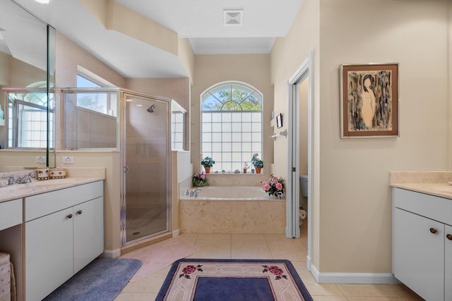 full bathroom with toilet, vanity, tile patterned flooring, and plus walk in shower