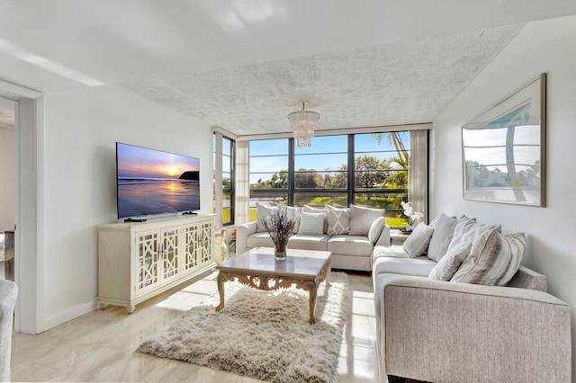 living room with expansive windows and a chandelier