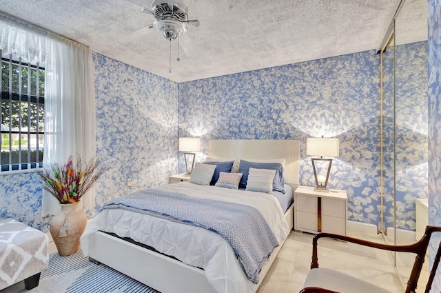 bedroom featuring light tile patterned floors and ceiling fan