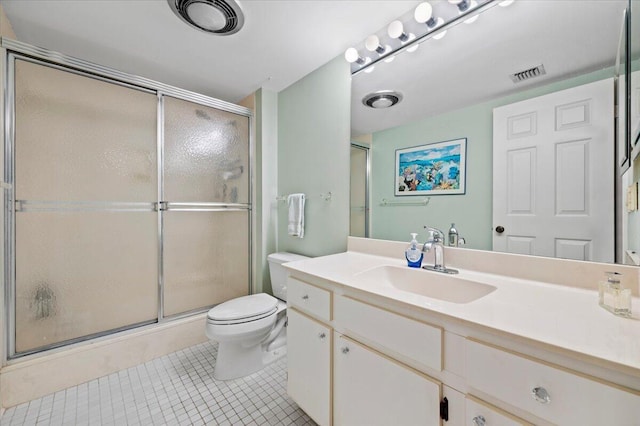 bathroom with tile patterned flooring, vanity, toilet, and an enclosed shower