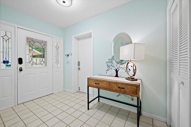 entrance foyer featuring a textured ceiling