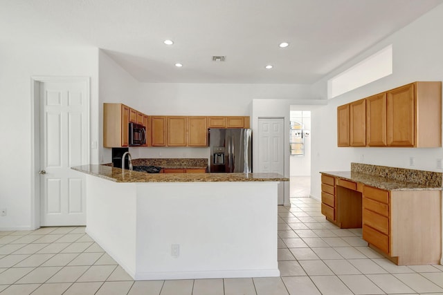 kitchen with kitchen peninsula, stone counters, light tile patterned floors, and stainless steel refrigerator with ice dispenser