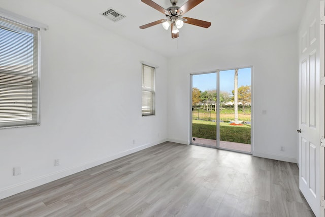 spare room with ceiling fan and light hardwood / wood-style floors