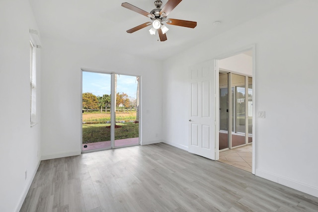 spare room with light hardwood / wood-style flooring and ceiling fan