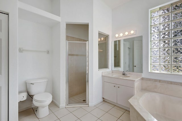 full bathroom featuring plus walk in shower, vanity, toilet, and tile patterned flooring