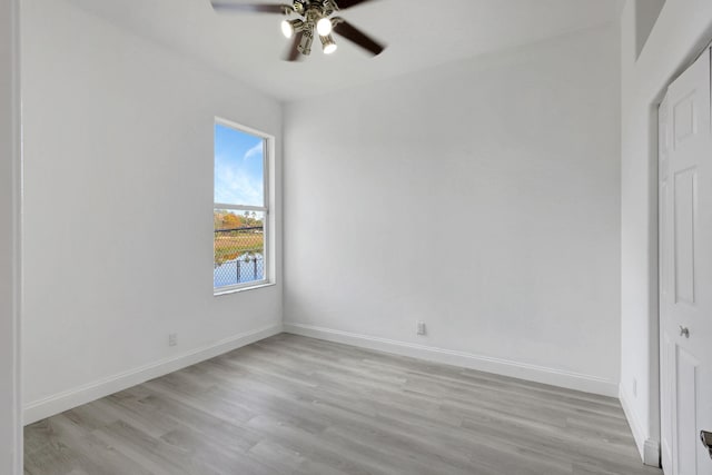 unfurnished bedroom with a closet, light hardwood / wood-style floors, and ceiling fan