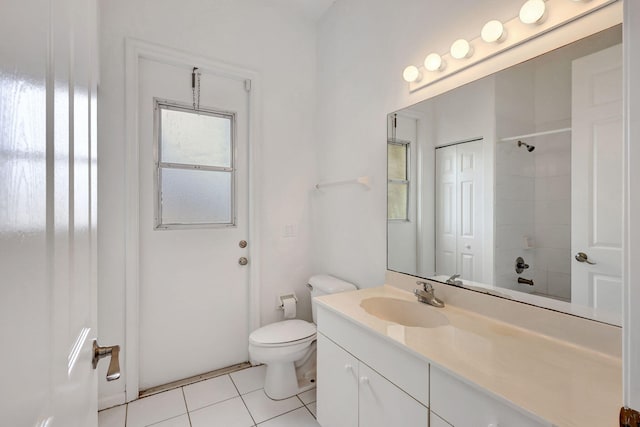 bathroom with tile patterned floors, vanity, and toilet