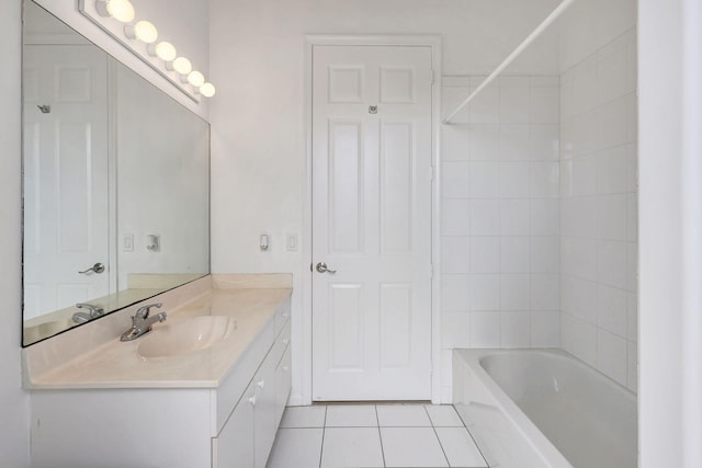 bathroom featuring tile patterned flooring, vanity, and tub / shower combination