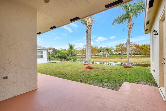 view of patio / terrace with a water view