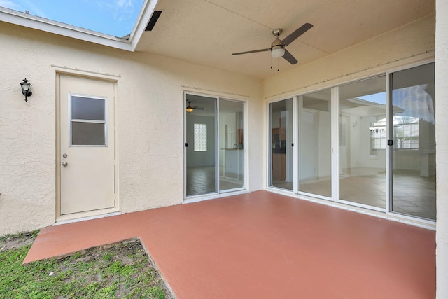 view of patio featuring ceiling fan