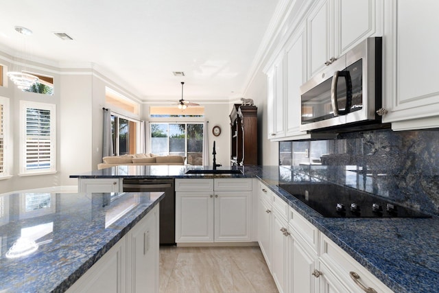 kitchen with white cabinetry, sink, and appliances with stainless steel finishes