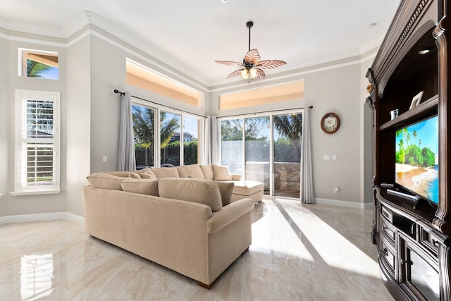 living room with ceiling fan, a healthy amount of sunlight, and crown molding