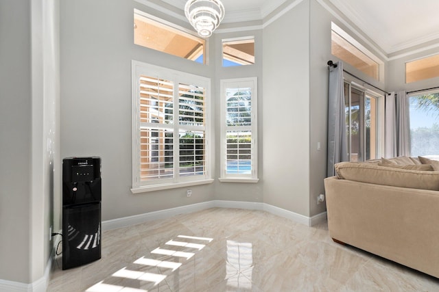 interior space with crown molding and an inviting chandelier