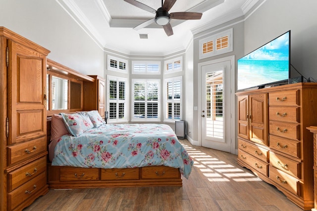 bedroom featuring access to exterior, hardwood / wood-style flooring, ceiling fan, and crown molding