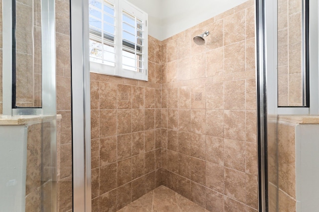 bathroom with tiled shower