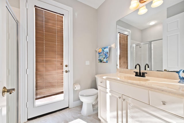 bathroom with tile patterned floors, vanity, an enclosed shower, and toilet