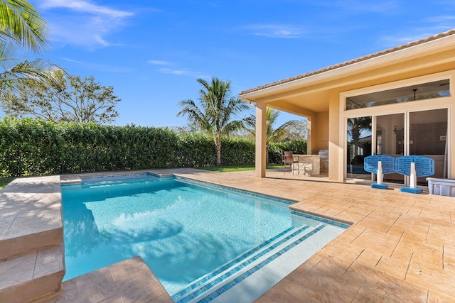 view of swimming pool featuring a patio