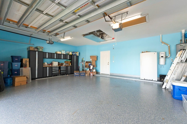 garage with white fridge and a garage door opener