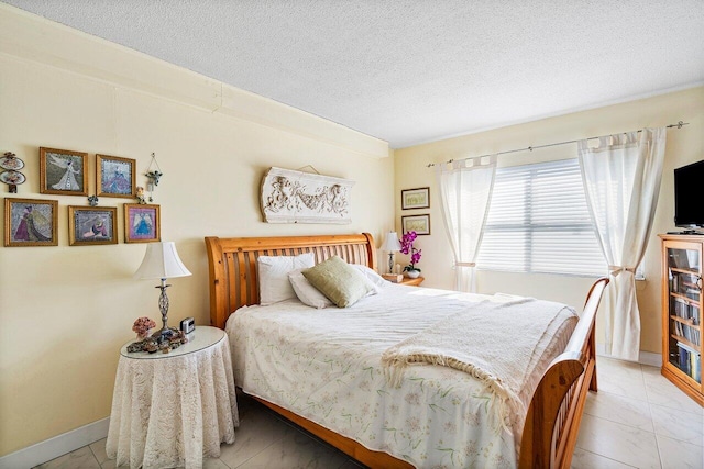 bedroom featuring a textured ceiling