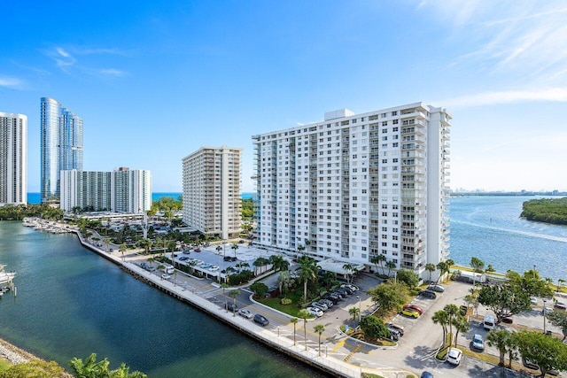 birds eye view of property with a water view